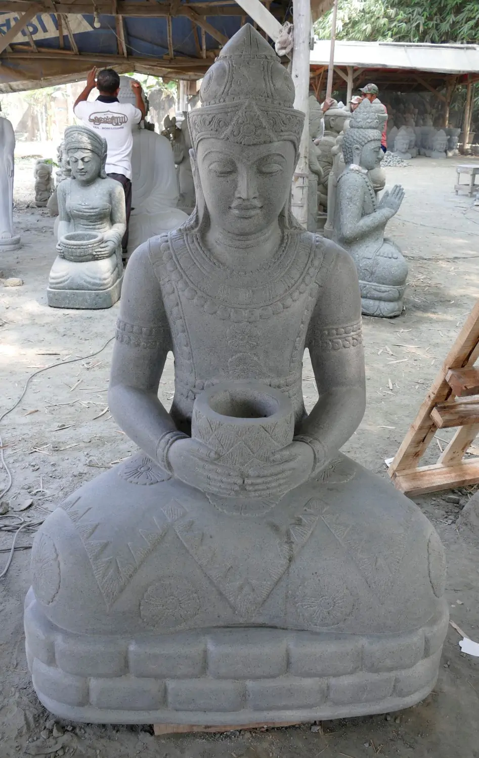  Product image 2 of the product “Seated Buddha in Thai style made of Riverstone, Holds a vessel in his hands, H. 150cm. ”